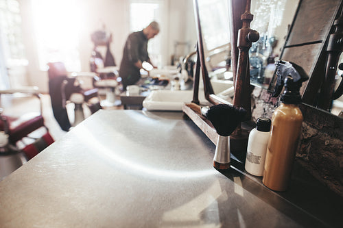 Hairdresser tools on counter at barber shop