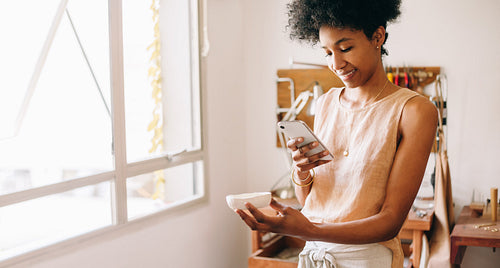Jeweler taking product photo in studio
