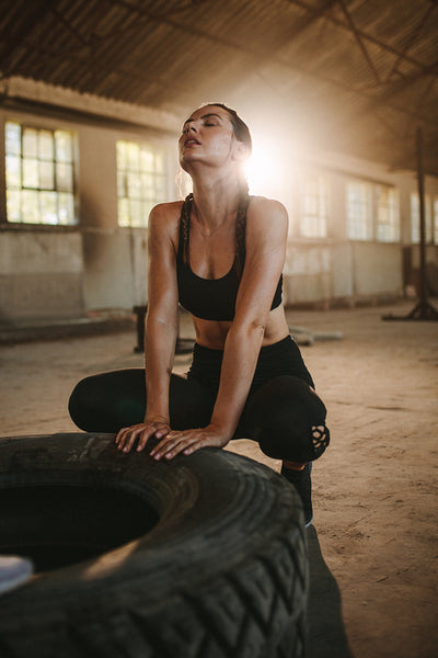 Tired woman after cross training session