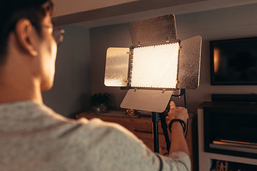 Photographer accommodates and tries out a flash setting