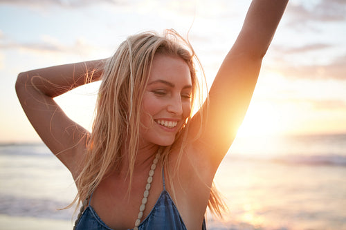 Smiling young caucasian woman at the beach