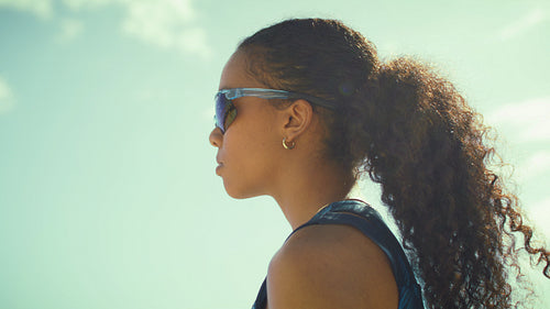 Close-up shot of a female beach volleyball player ready to play