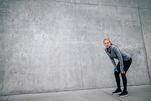 Woman athlete runner taking a break