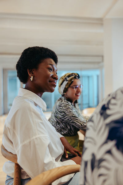 Attentive female colleagues listening during a relaxed and collaborative business meeting