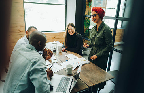 Cheerful businesspeople having a meeting in a boardroom