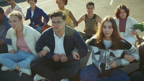 Youth sitting in unity for action