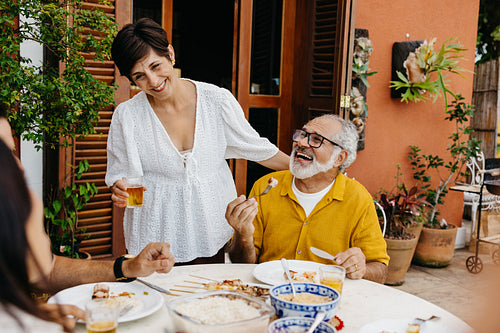 Brazilian family spending quality time during an outdoor barbecue celebration
