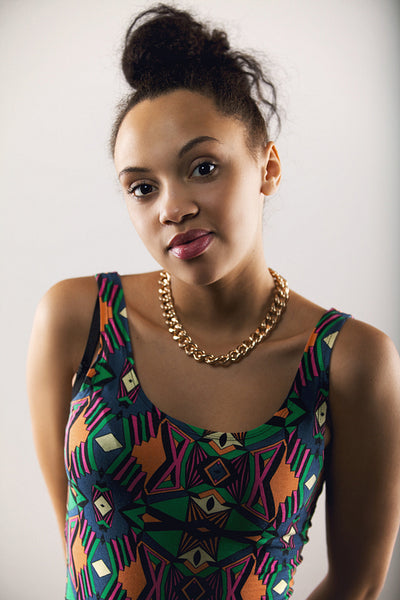 Young hispanic female fashion model posing