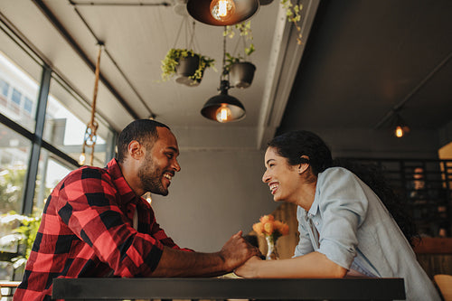 Beautiful couple on date at cafe