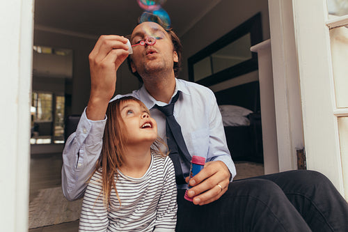 Father and daughter playing at home