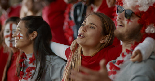 English soccer supporters singing together in stadium
