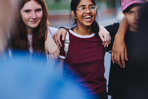 Group of happy teenage activists standing together in a circle