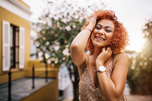 Portrait of a young woman in glamorous dress.