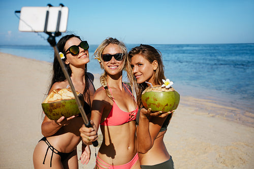 Group of young woman taking selfie on the beach