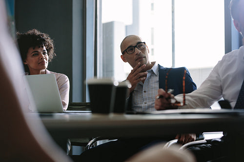 Corporate professionals during strategy meeting