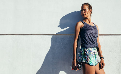 Female runner relaxing after workout.