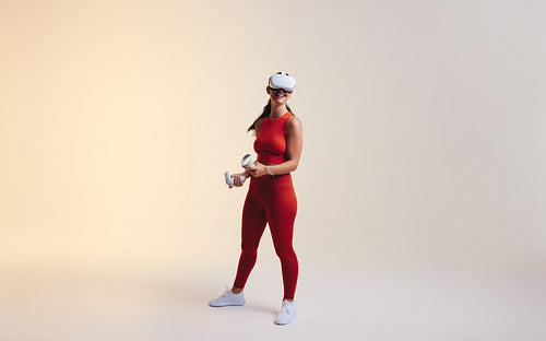 Female gamer enjoying a virtual reality experience