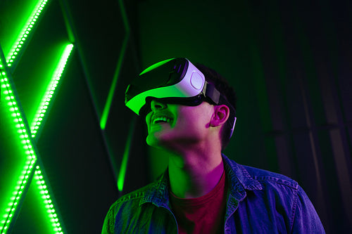 Man watching a Vr game using virtual reality goggles