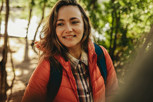 Beautiful woman with backpack on camping