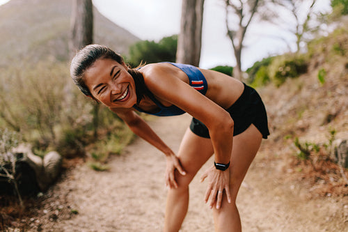 Female runner taking a break after running workout