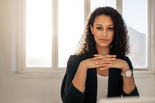 Woman entrepreneur sitting in office