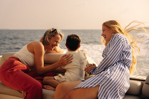 Family togetherness: Sharing a vacation by the ocean at sunset