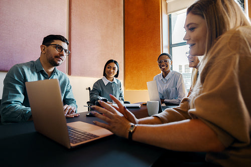 Diverse business team in a meeting discussing ideas and working together