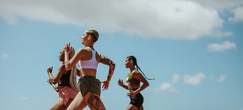 Female runners competing in a track event