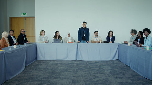 Diverse professionals discuss business strategies at a corporate conference