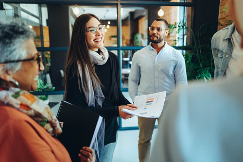 Diverse businesspeople holding a meeting in a modern workplace
