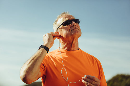 Close up of a senior man listening to music