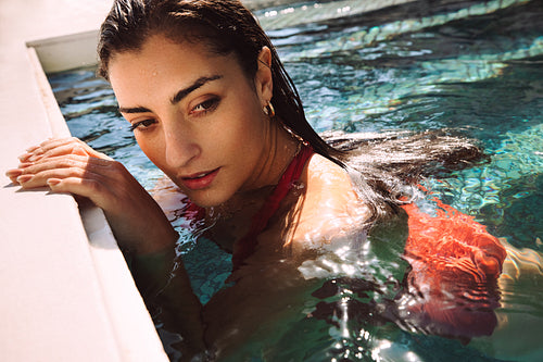 Young woman swimming alone while on a vacation