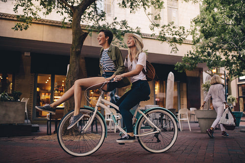 best friends enjoying bicycle ride