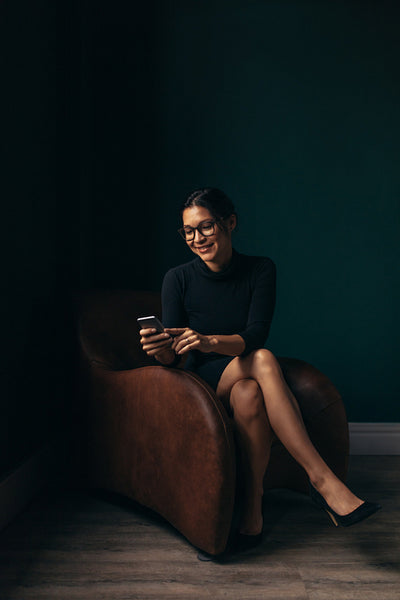Sophisticated asian female using mobile phone