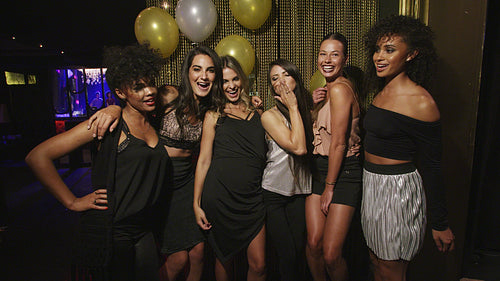 Multi-ethnic women friends enjoying at the party