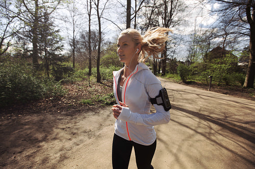 Fitness woman running in park