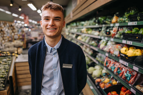 Youmg man on a holiday job in a supermarket