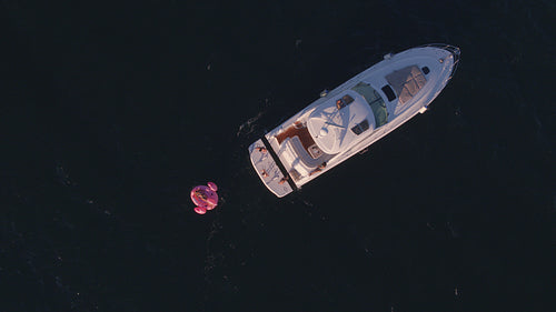 Friends jumping from the yacht