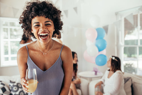 Laughing african woman at friend's baby shower
