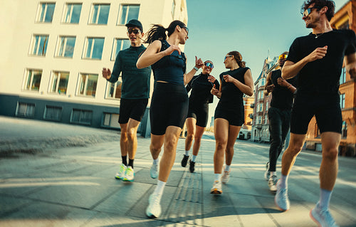 Training keeps the running group moving through the city in an urban workout