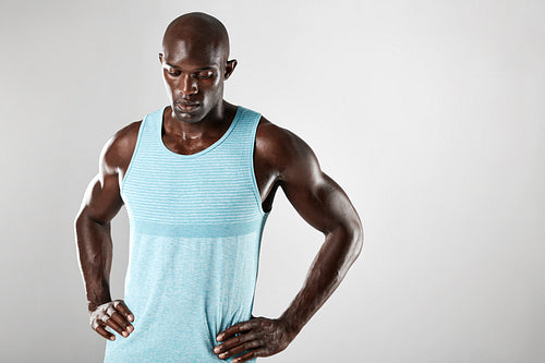 Masculine young african man over grey background