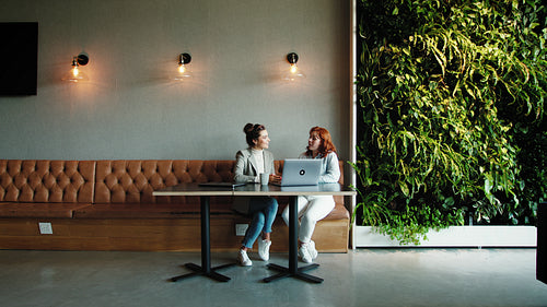 Female designers having a discussion in a coworking office