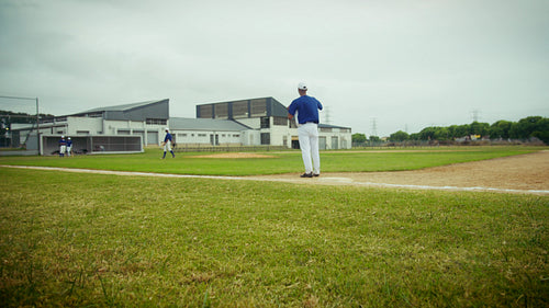 Pitcher throws ball during a baseball game