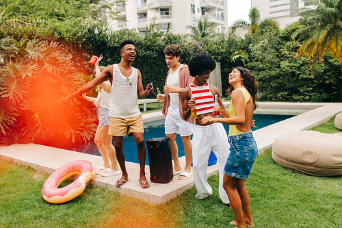 Poolside party with friends by a tropical pool