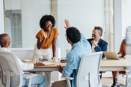 Successful collaboration of business colleagues in a creative boardroom meeting