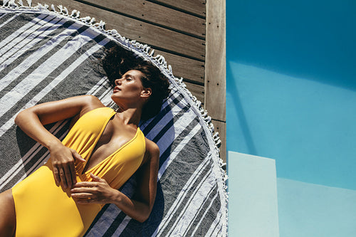 Woman relaxing in stylish swimwear