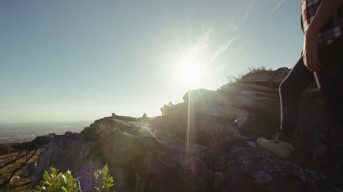 Friends on a mountain hike on sunny day.