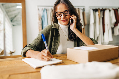 Female ecommerce entrepreneur ensures swift delivery with shipping confirmation call