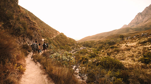 Extreme rocky terrain in mountains with hikers