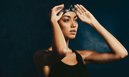 Woman swimwear with swimming goggles